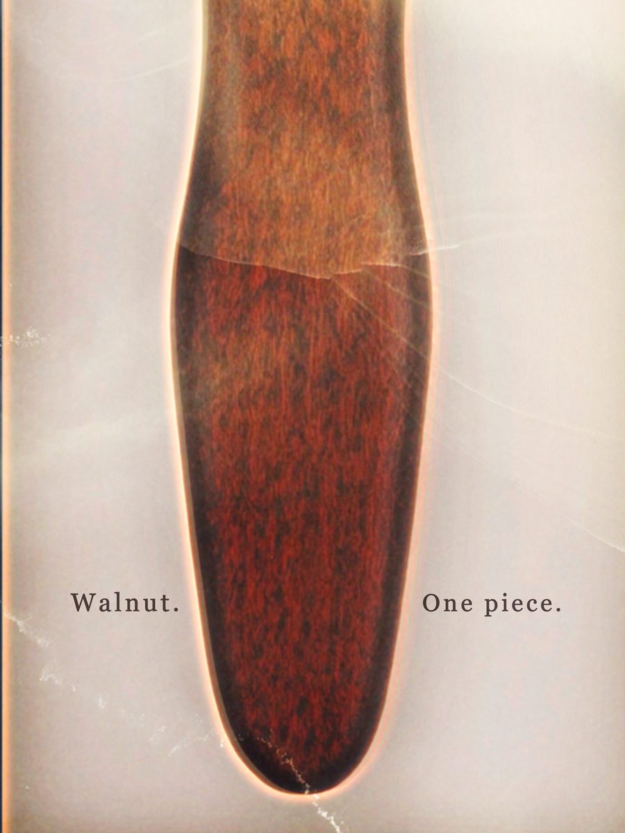 Campaign page: a macro photograph of the brush handle, the words Walnut and One piece split either side of it