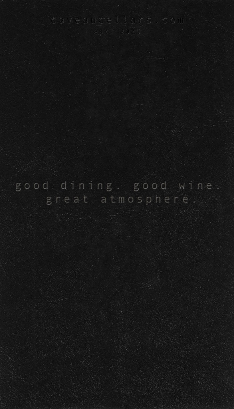 Black leather ground with debossed type reading good dining, good wine, great atmosphere