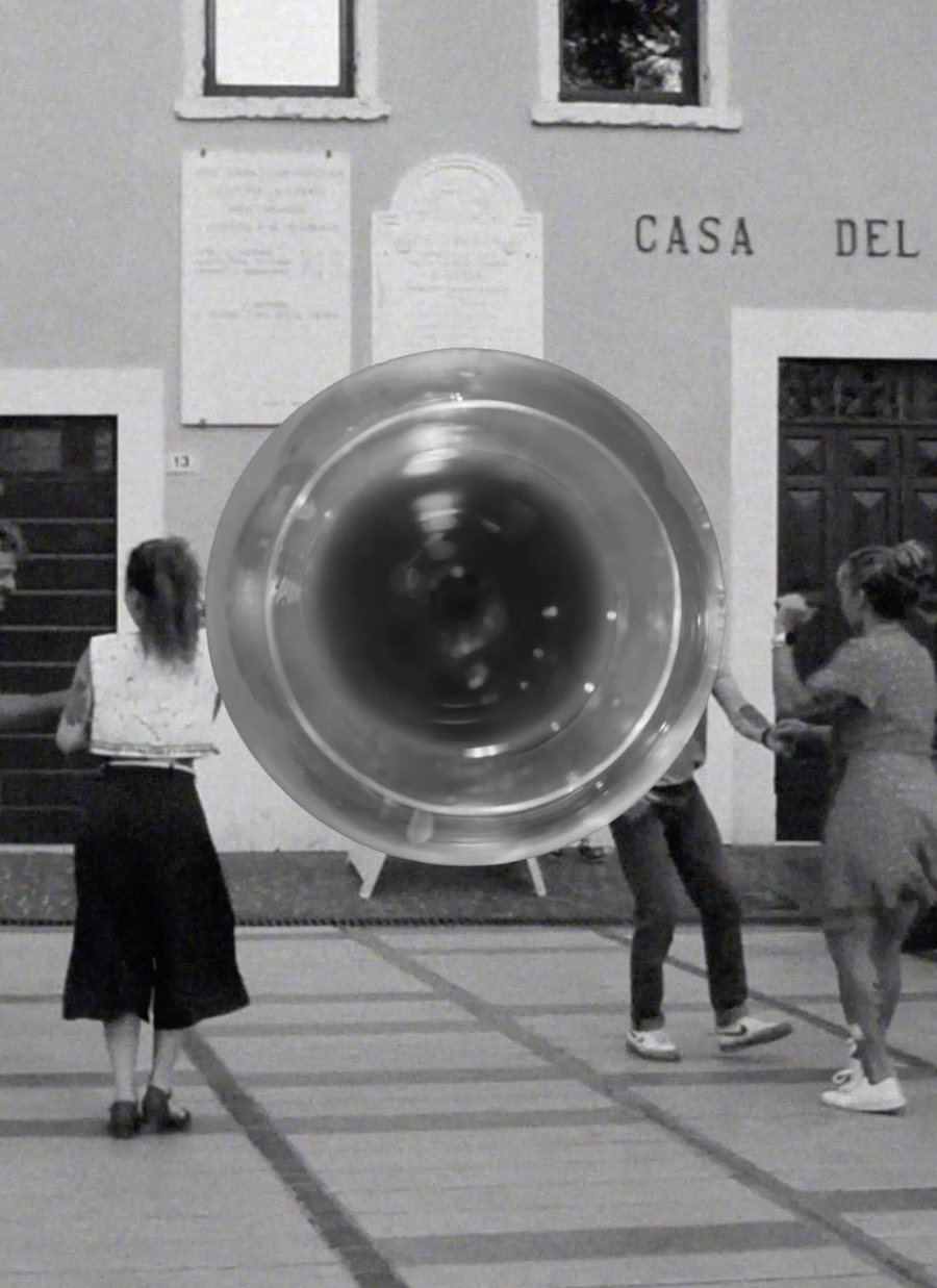 The same glass overlaid on a black and white photograph of dancers in a piazza