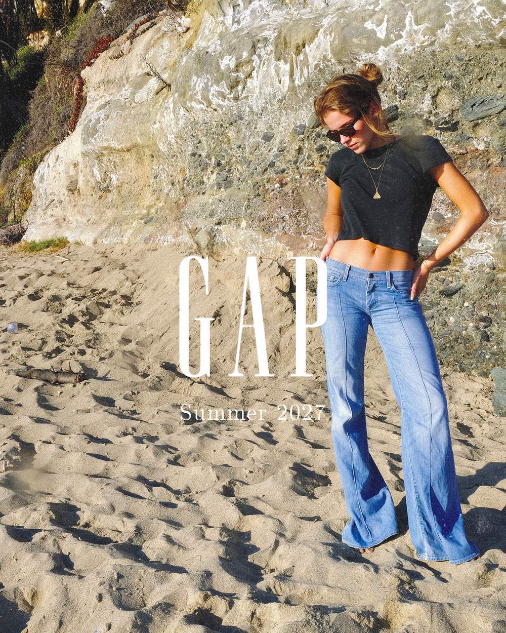Closing slide: full-length in light flared denim and a black tee, the Gap wordmark and Summer 2027 set to the left