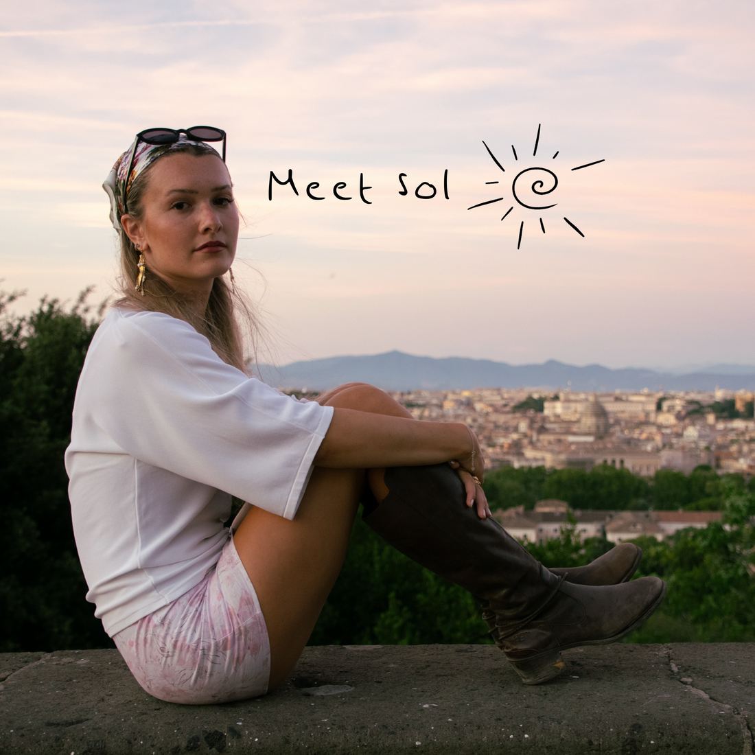 Meet Sol — portrait of Sol Feiguin seated above Rome at dusk, with the Paseos Del Sol sun mark